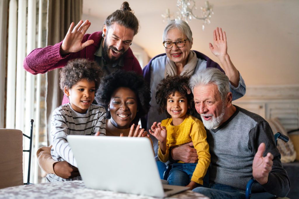 Portrait of a happy multigenerational multiethnic family at home. People group technology love concept